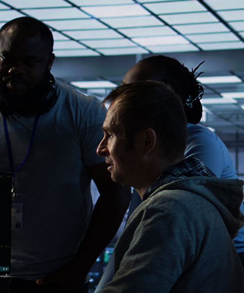 people looking at the computer screen in the office