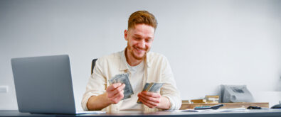 man counting money he saved with using Open-E JovianDSS