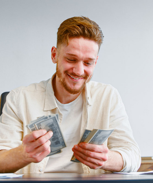 man counting money he saved with using Open-E JovianDSS