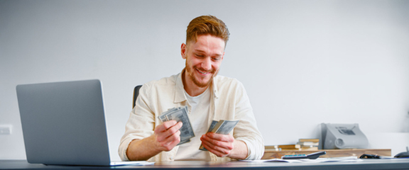 man counting money he saved with using Open-E JovianDSS
