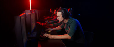 a group of men playing competitive e-sport video games