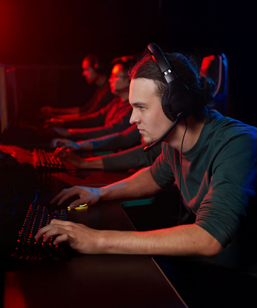 a group of men playing competitive e-sport video games