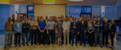 Open-E Team standing together at in the restaurant hall