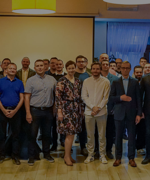Open-E Team standing together at in the restaurant hall