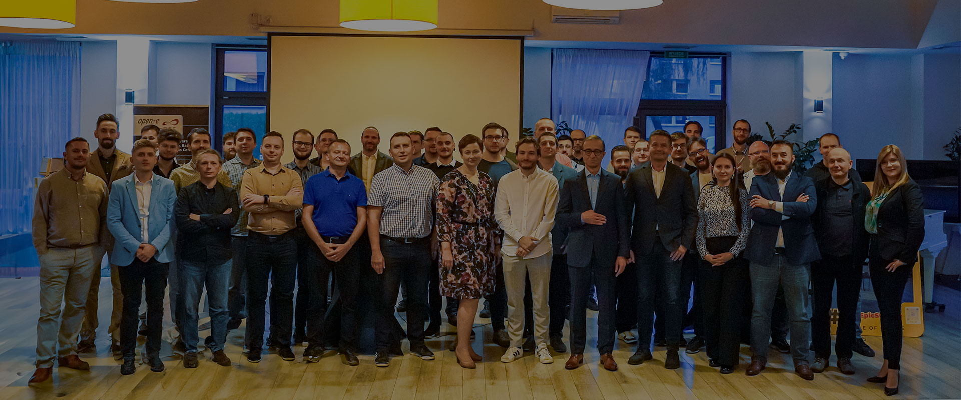 Open-E Team standing together at in the restaurant hall