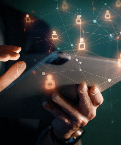 IT Administrator hands holding tablet; digital icons around