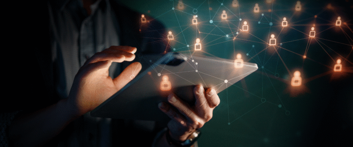 IT Administrator hands holding tablet; digital icons around