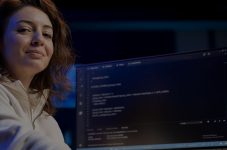 Women sitting in front of computer coding