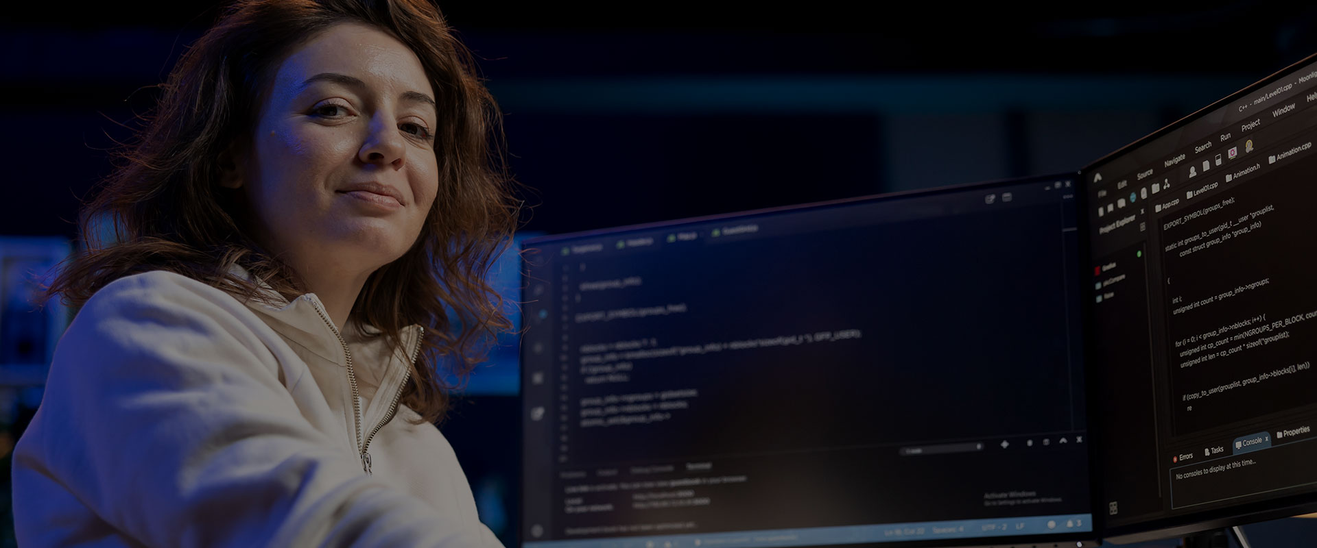 Women sitting in front of computer coding