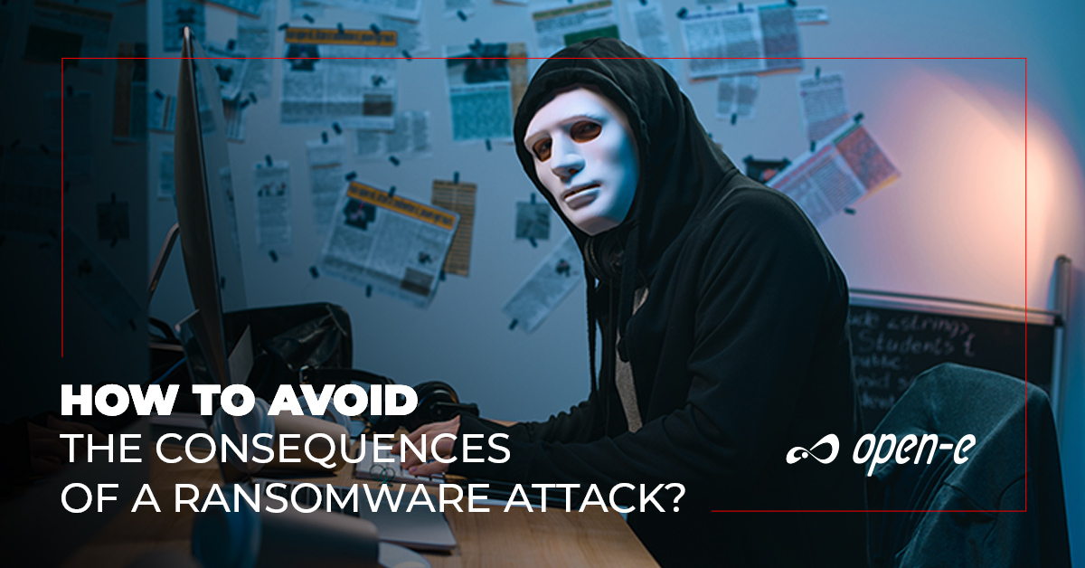 How To avoid Consequences of Ransomware Attack - hacker sitting in front of the computer looking at the camera