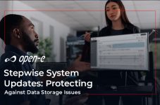 People in the office in front of computer waiting for a program update