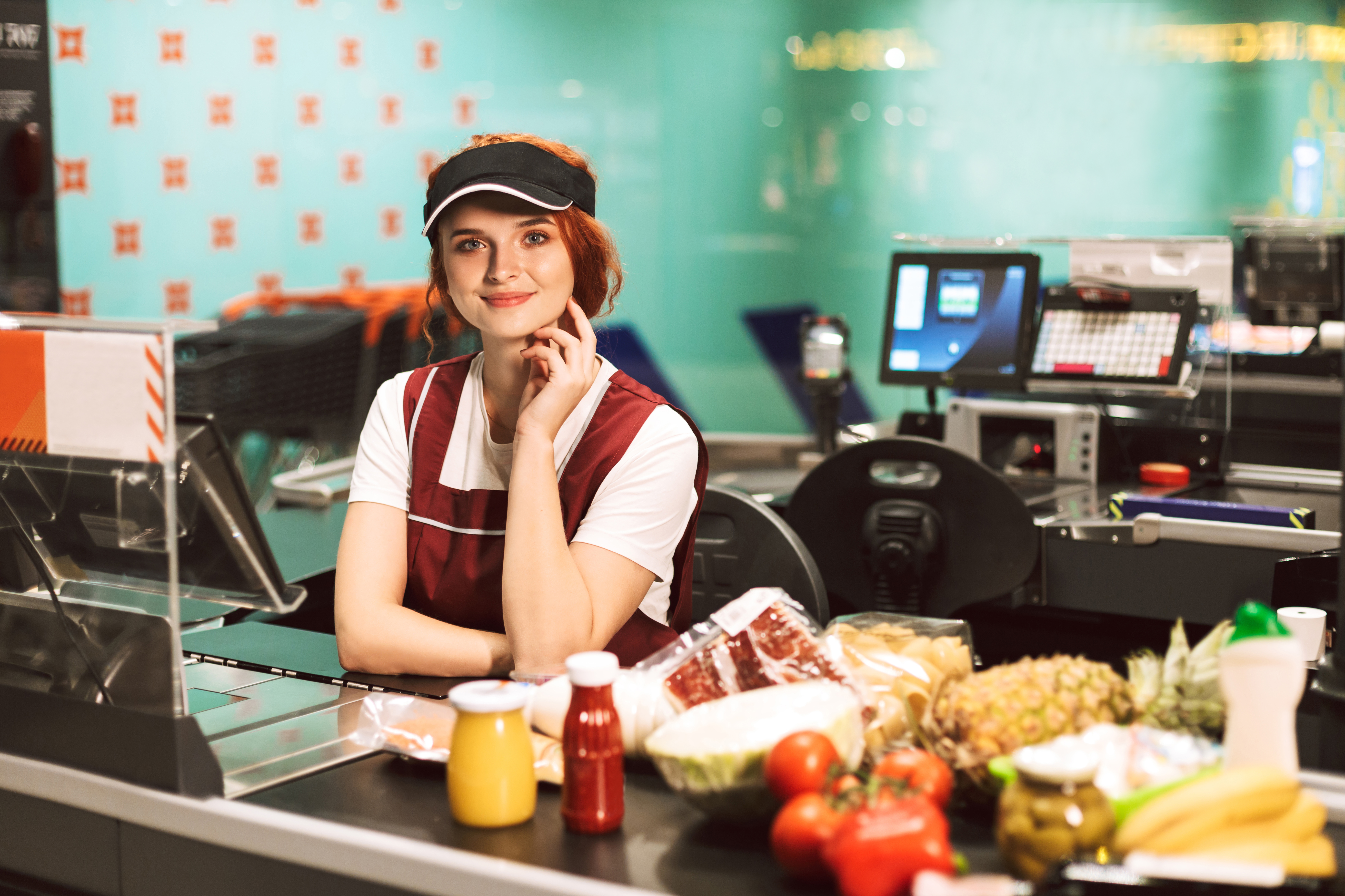woman working in supermarket and smiling Open-E JovianDSS solutions for retail